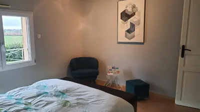 Un ou plusieurs lits dans un hébergement de l'établissement Les Chambres des 4 Vents - Chambres doubles à l'étage