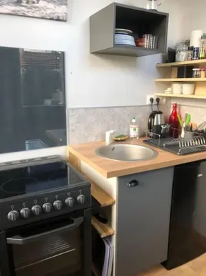 Cuisine ou kitchenette dans l'établissement appartement indépendant dans jardin privé