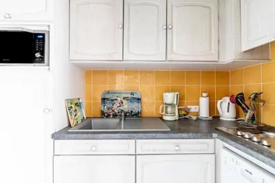 Cuisine ou kitchenette dans l'établissement Propriété historique La Joséphine 1828