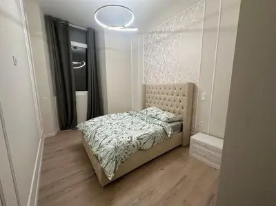 Un ou plusieurs lits dans un hébergement de l'établissement Appartement 4 chambres