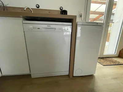 Cuisine ou kitchenette dans l'établissement La maison aux volets bleus