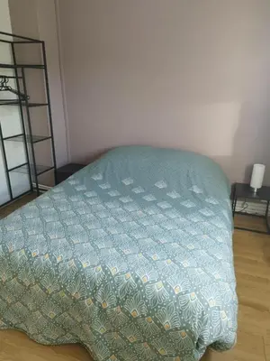 Un ou plusieurs lits dans un hébergement de l'établissement Cozy House
