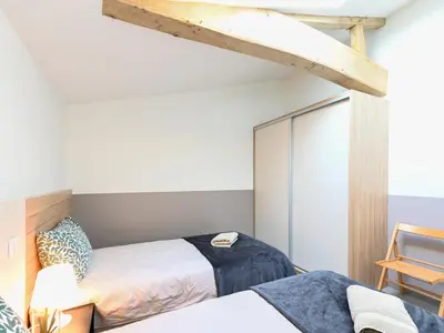 Un ou plusieurs lits dans un hébergement de l'établissement Gîte L'Art du Rustique Chic - Sérénité et Elégance