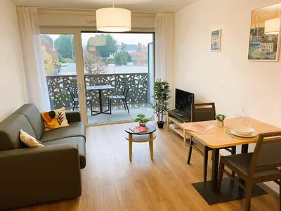 Télévision ou salle de divertissement dans l'établissement La Résidence Cholet