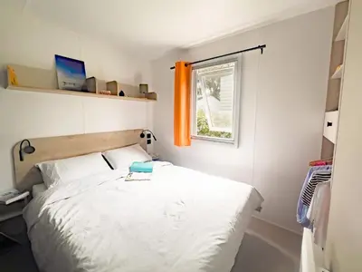 Un ou plusieurs lits dans un hébergement de l'établissement Camping 3 étoiles - Parc aquatique - ccaff0b