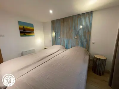 Un ou plusieurs lits dans un hébergement de l'établissement Maison moderne avec clim, jardin et parking, proche plage Noirmoutier - FR-1-426-565