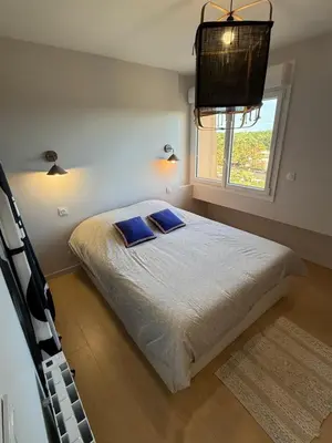 Un ou plusieurs lits dans un hébergement de l'établissement Appartement face mer
