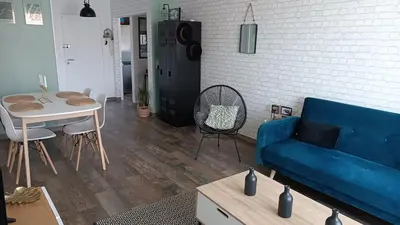 Coin salon dans l'établissement Charmant appartement proche Thales