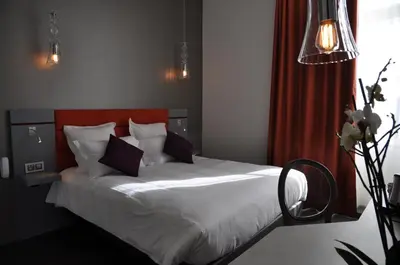 Un ou plusieurs lits dans un hébergement de l'établissement Les 3 Lieux - Hôtel, Restaurant, Espace sensoriel