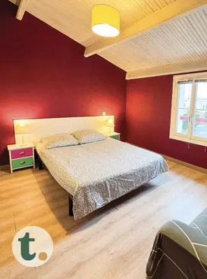 Un ou plusieurs lits dans un hébergement de l'établissement Tranquiloue - Grande maison spacieuse - PuyduFou