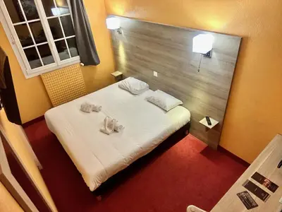 Un ou plusieurs lits dans un hébergement de l'établissement Hôtel Particulier LE MAS DES MARAIS