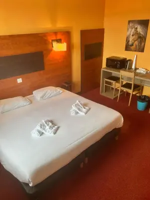 Un ou plusieurs lits dans un hébergement de l'établissement Hôtel Particulier LE MAS DES MARAIS