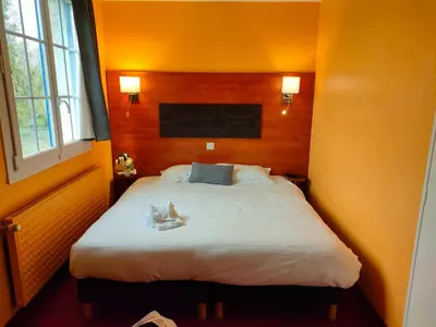 Un ou plusieurs lits dans un hébergement de l'établissement Hôtel Particulier LE MAS DES MARAIS