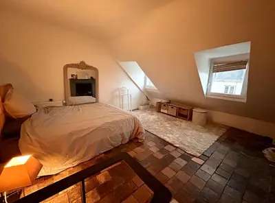 Un ou plusieurs lits dans un hébergement de l'établissement Beau Duplex plein centre avec vue, idéal télétravail