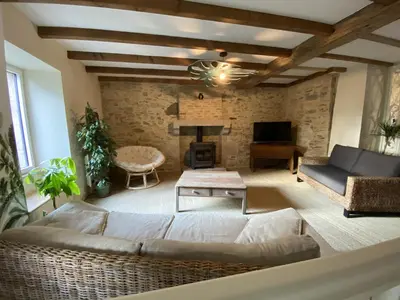 Coin salon dans l'établissement Maison l'or du temps gite Les Vignes