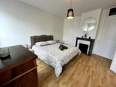 Un ou plusieurs lits dans un hébergement de l'établissement Delorme 2pers Tv & Wifi