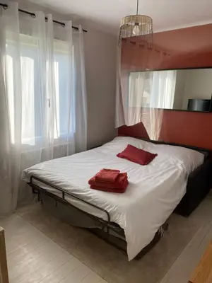 Un ou plusieurs lits dans un hébergement de l'établissement Saint Nazaire 4 chbres 15min de la plage à Saint Marc KER LOT MARC