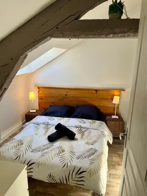 Un ou plusieurs lits dans un hébergement de l'établissement Casa Cocon -Charmant T3-plages, centre ville- 4 personnes