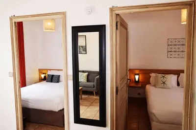 Un ou plusieurs lits dans un hébergement de l'établissement Eco-Domaine La Fontaine - RESIDENCE-SPA - 300 m Plage de la Fontaine aux Bretons