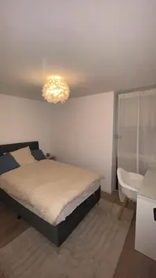 Un ou plusieurs lits dans un hébergement de l'établissement Maison cozy proche centre ville