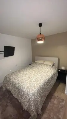 Un ou plusieurs lits dans un hébergement de l'établissement Maison cozy proche centre ville
