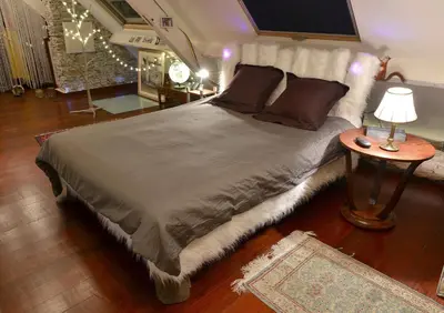 Un ou plusieurs lits dans un hébergement de l'établissement Le Loft de l'artiste