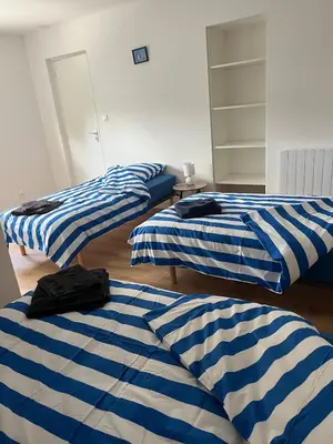 Un ou plusieurs lits dans un hébergement de l'établissement Appartement des dauphins