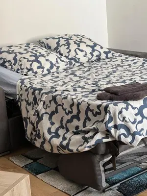 Un ou plusieurs lits dans un hébergement de l'établissement Appartement des dauphins