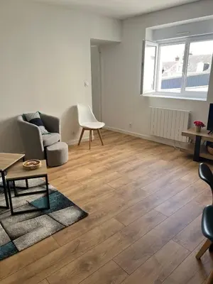 Coin salon dans l'établissement Appartement des dauphins