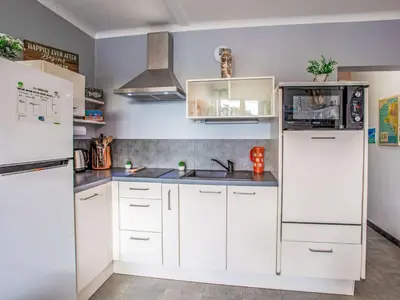 Cuisine ou kitchenette dans l'établissement Apartment Les Tilleuls-2 by Interhome