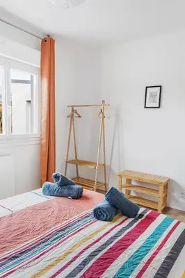 Un ou plusieurs lits dans un hébergement de l'établissement La Catinou - Maison confortable et spacieuse