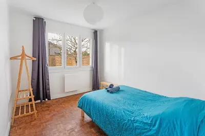 Un ou plusieurs lits dans un hébergement de l'établissement La Catinou - Maison confortable et spacieuse