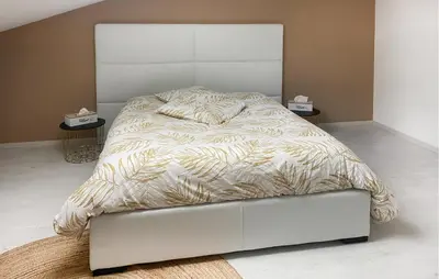 Un ou plusieurs lits dans un hébergement de l'établissement Jolie Maison