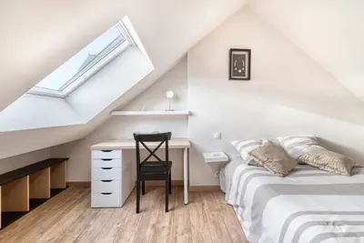 Un ou plusieurs lits dans un hébergement de l'établissement Chez Popone Maison de bourg