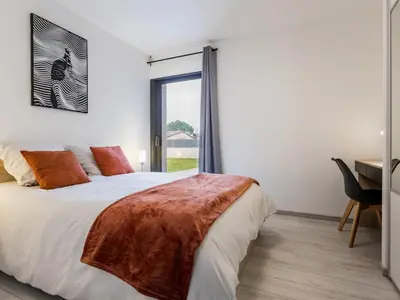 Un ou plusieurs lits dans un hébergement de l'établissement Gîte calme avec spa et terrasse, proche Nantes et Clisson - FR-1-306-1292