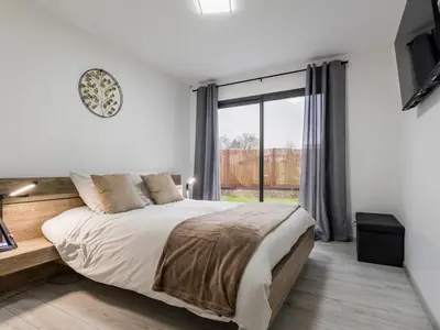 Un ou plusieurs lits dans un hébergement de l'établissement Gîte calme avec spa et terrasse, proche Nantes et Clisson - FR-1-306-1292