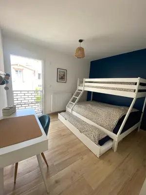 Un ou plusieurs lits dans un hébergement de l'établissement Appartement cosy à 100m de la plage