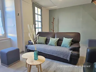Coin salon dans l'établissement Le Relais 19 centre bourg T4 100m2 - 4min à Puy duFou