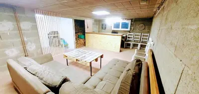 Coin salon dans l'établissement Maison Le Baron 13pers Tiffauges proche Puy du Fou