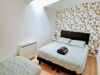 Un ou plusieurs lits dans un hébergement de l'établissement Maison de Bourg St Amand 5pers 15min Puy du Fou