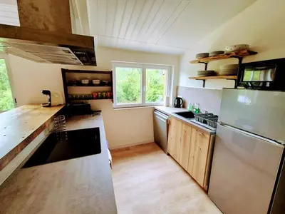 Cuisine ou kitchenette dans l'établissement Le Pont Haut vue sur Rivière proche Puy du Fou