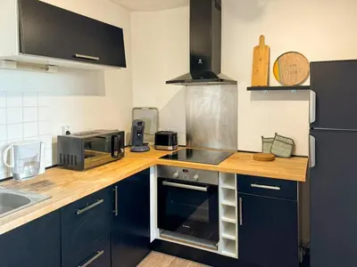 Cuisine ou kitchenette dans l'établissement Charmant Duplex Lumineux
