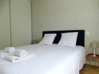 Un ou plusieurs lits dans un hébergement de l'établissement Maison 6 avec piscine chauffée à St-Hilaire