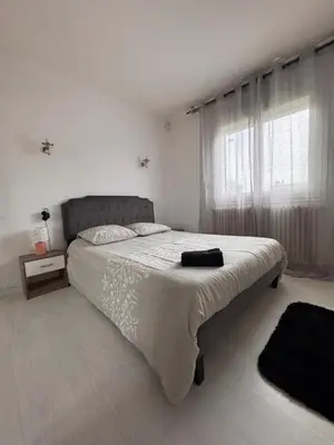 Un ou plusieurs lits dans un hébergement de l'établissement Maison des rivages 3 chambres