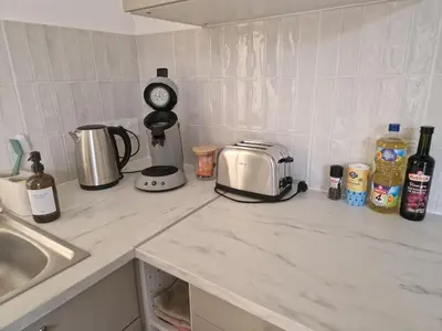 Cuisine ou kitchenette dans l'établissement Joli appartement à Paimboeuf