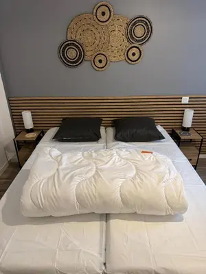 Un ou plusieurs lits dans un hébergement de l'établissement Yellow Beach, T2 neuf avec jardin