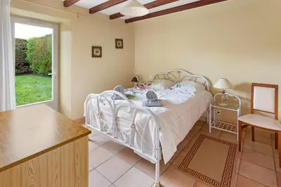 Un ou plusieurs lits dans un hébergement de l'établissement Le Gîte du Verger - Calme, paisible et jardin