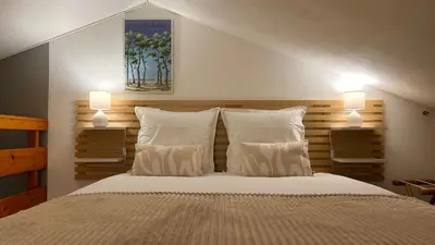 Un ou plusieurs lits dans un hébergement de l'établissement L'Atlantide Maison & Spa - Accès direct à la plage