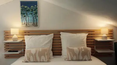 Un ou plusieurs lits dans un hébergement de l'établissement L'Atlantide Maison & Spa - Accès direct à la plage