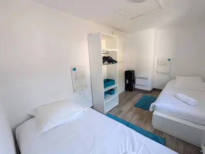 Un ou plusieurs lits dans un hébergement de l'établissement Maison dans résidence avec piscine et tennis - 4 personnes